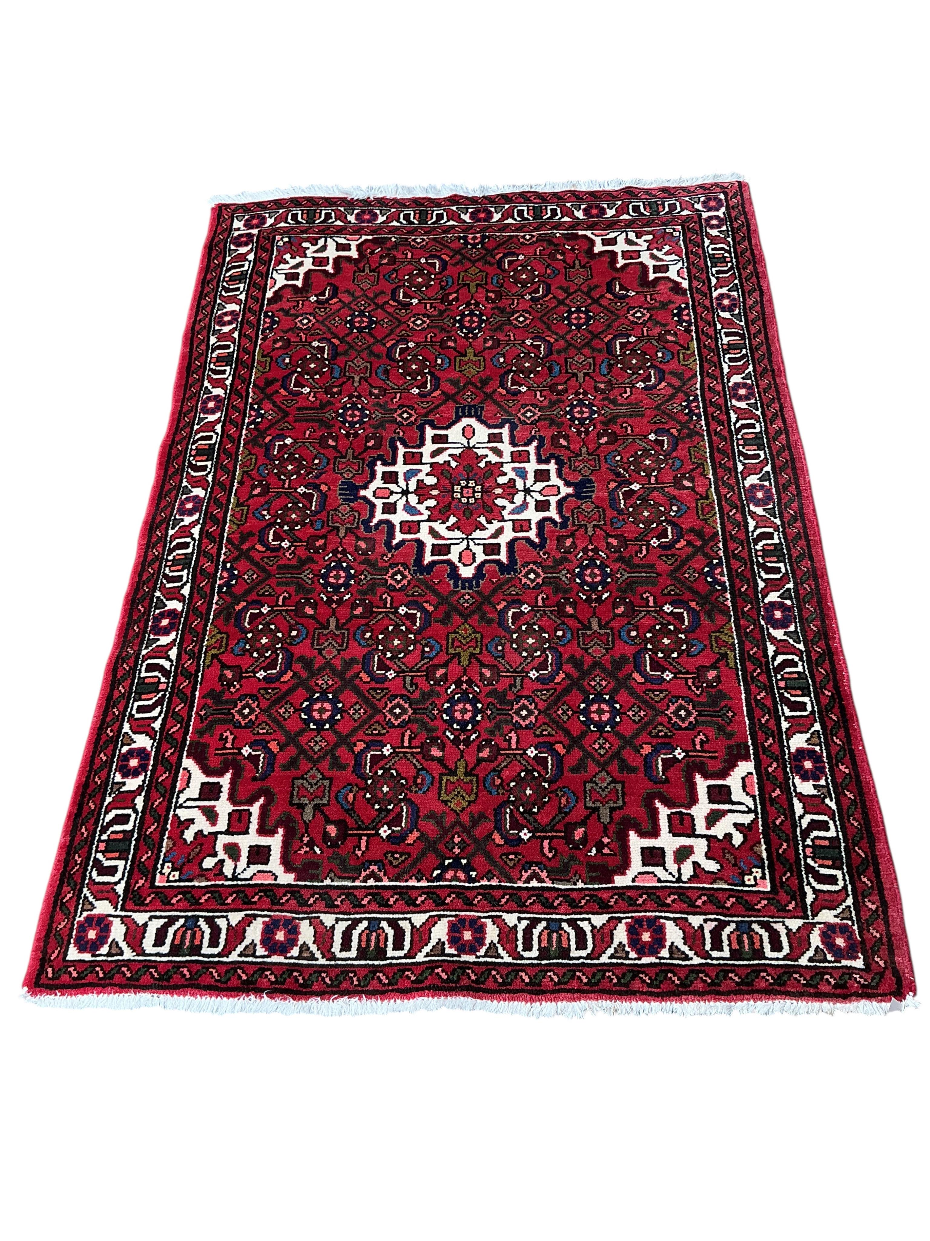 A Hamadan red ground rug, 160 x 110cm